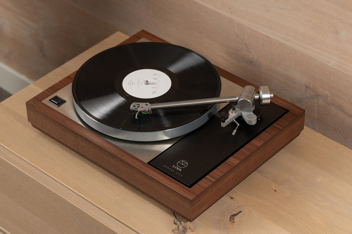 Linn Klimax LP12 turntable on the Bedrok plinth, playing a record, three-quarter view