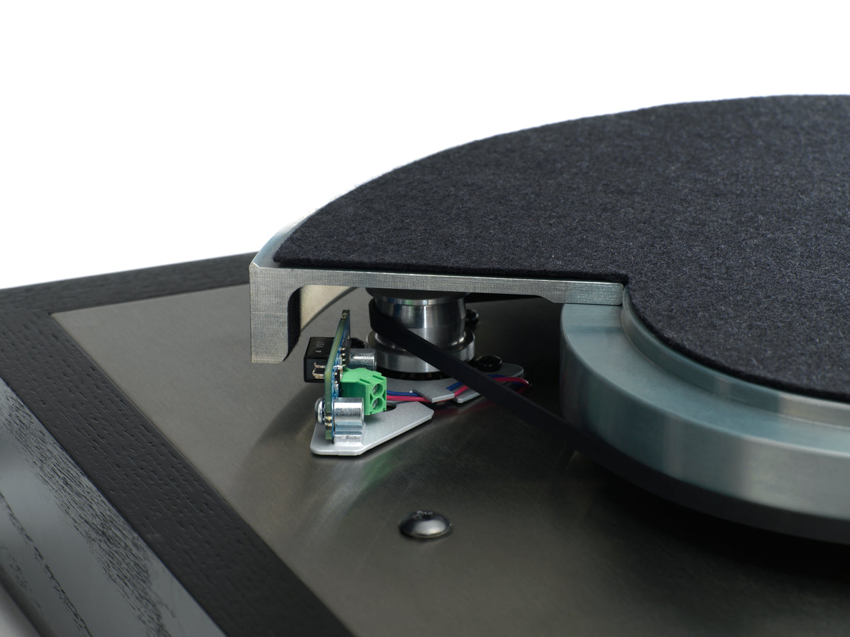Cutaway of a Linn LP12 showing the Radikal motor and the speed sensor reading the platter