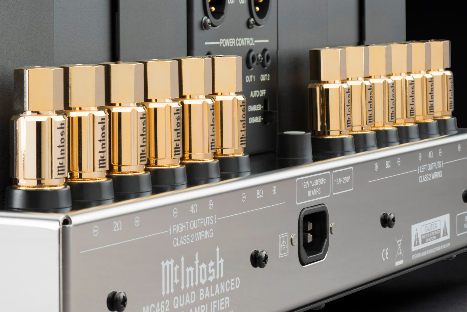 McIntosh factory close-up of two banks of gold-plated Solid Cinch speaker binding posts on the rear of an MC462 amplifier.