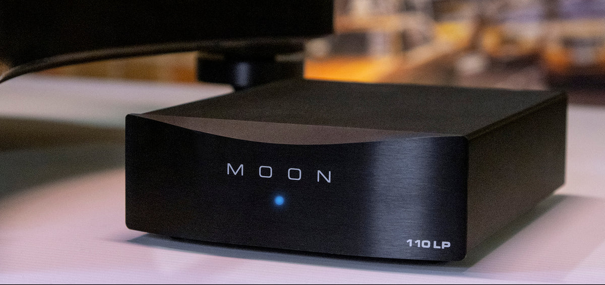 MOON 110LP v2 lifestyle view with a turntable