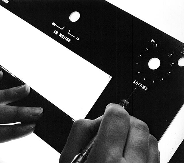 The glass front panel of the 1960s: screen-printed from the back in McIntosh's own ink, gold in daylight, teal when lit
